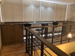 loft area with high stools and countertop