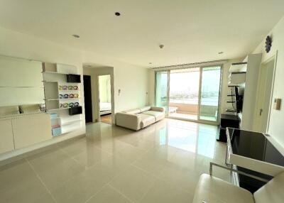 Modern living room with large windows and balcony view