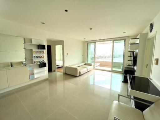 Modern living room with large windows and balcony view