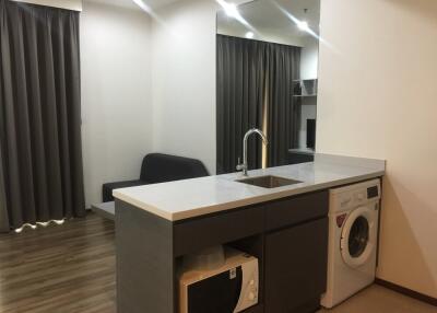 Modern kitchen with appliances and seating area