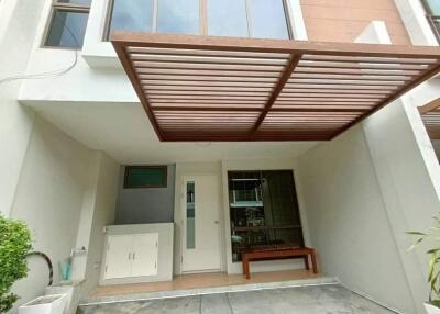 Exterior view of a modern house with a carport