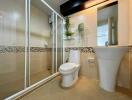 Modern bathroom with shower, toilet, and sink