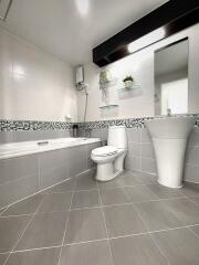 Modern bathroom with bathtub and sleek fixtures