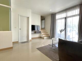 Modern living room with natural light and minimalist decor