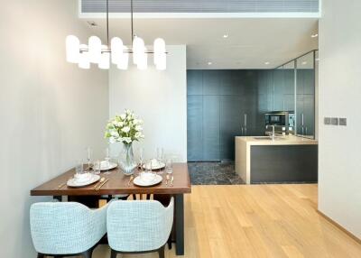 Modern dining area adjacent to a sleek kitchen