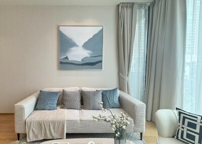 Modern living room with comfortable sofa and wall art