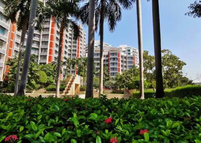Modern apartment buildings with lush garden