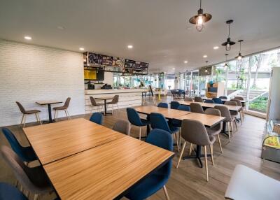 Spacious cafe seating area with modern furniture