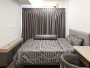 Modern bedroom with grey curtains and bedding