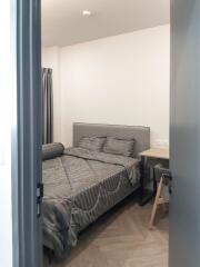 Modern bedroom with gray tones and study desk