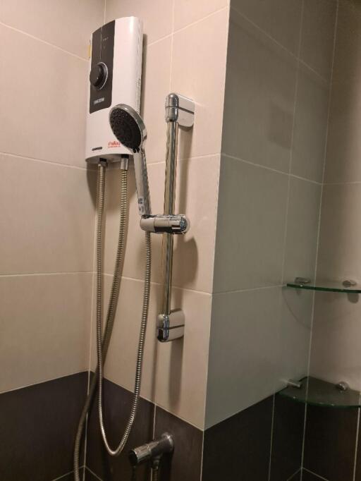 Image of a bathroom with a shower and water heater