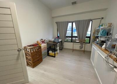 Light-filled room with window and assorted furniture