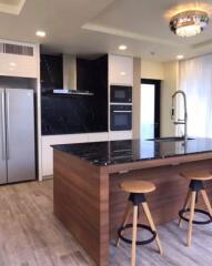 Modern kitchen with island and bar stools