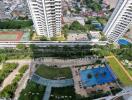 Aerial view of a residential complex with multiple high-rise buildings and amenities