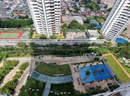 Aerial view of a residential complex with multiple high-rise buildings and amenities