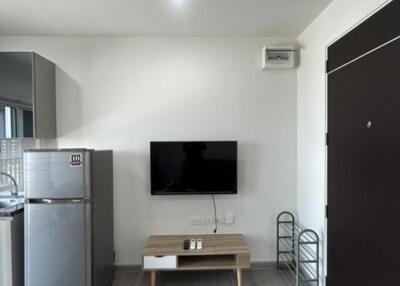 Modern living room with TV and refrigerator