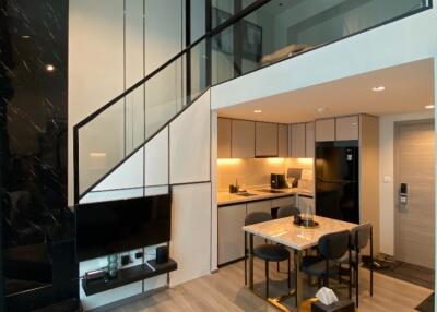 Modern living area with loft and kitchen