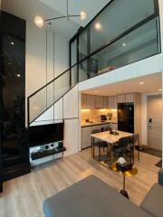 Modern living area with loft and kitchen