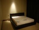 Bedroom with bed and dimmed lighting