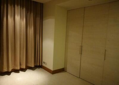 Bedroom with closet and curtains