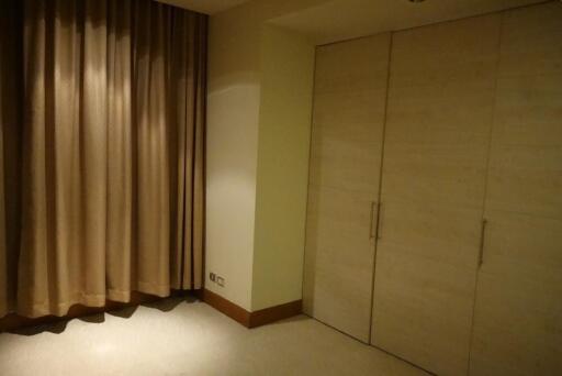 Bedroom with closet and curtains