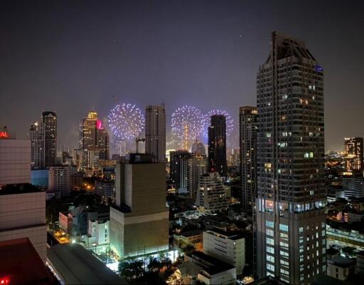 City skyline view at night with fireworks