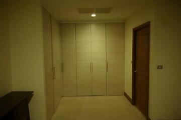 Bedroom with built-in wooden wardrobes