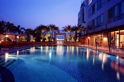 Pool area with evening lighting