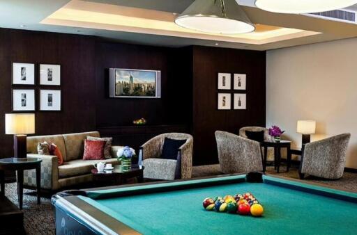 Living area with furniture and pool table