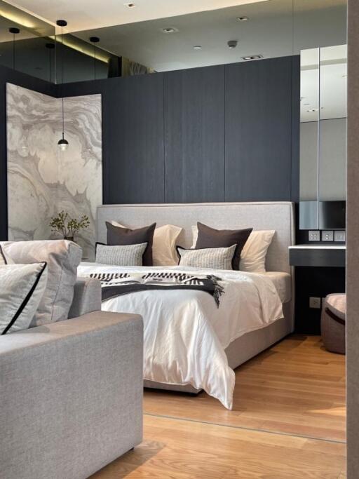 Modern bedroom with grey accents and king-sized bed