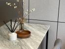 Modern kitchen table with marble surface and decorative items