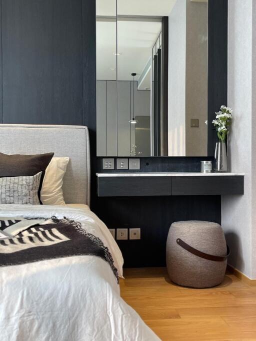 Modern bedroom with side table and decor