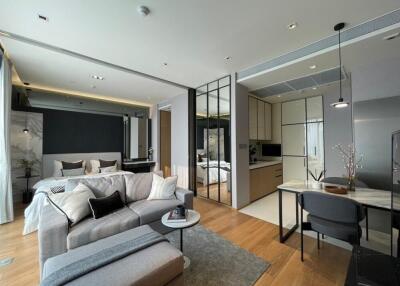 Modern open-concept living area with kitchen and bedroom