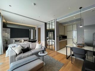 Modern open-concept living area with kitchen and bedroom