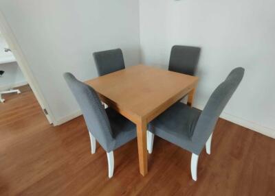 Dining area with table and four chairs