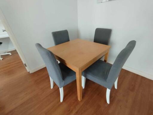 Dining area with table and four chairs