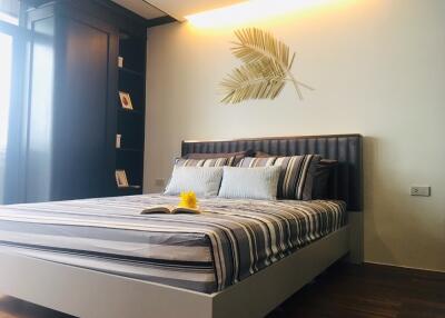 Modern bedroom with a double bed and decorative wall art