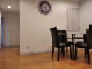 Dining area with a clock on the wall