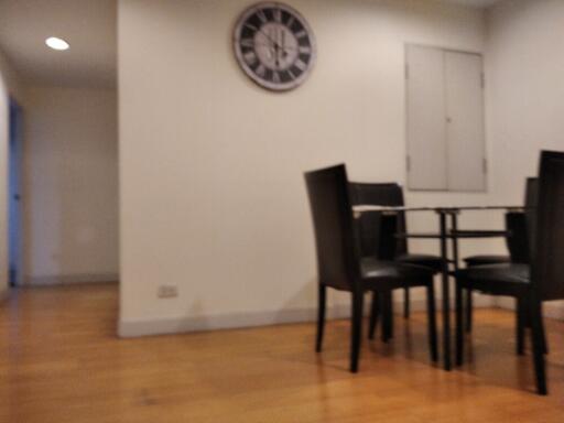 Dining area with a clock on the wall