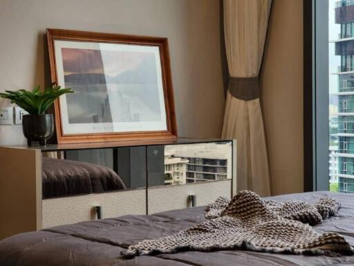 Modern bedroom with a view of cityscape