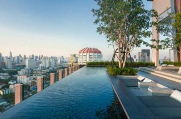 Rooftop infinity pool with city skyline view