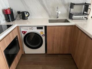 Modern kitchen with wooden cabinetry and appliances