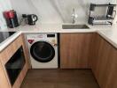 Modern kitchen with wooden cabinetry and appliances