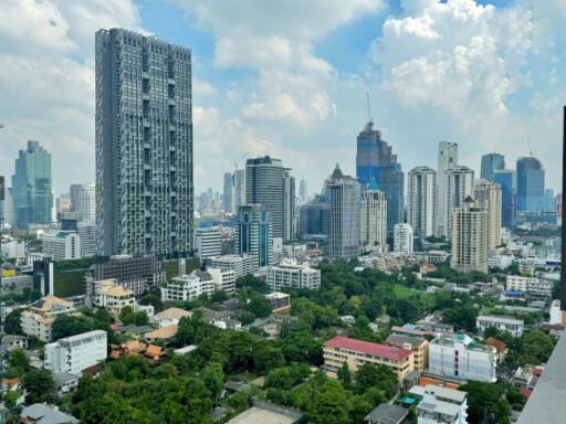 Cityscape with tall buildings and greenery