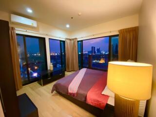 Bedroom with night city view