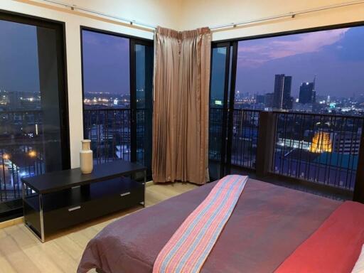 Bedroom with city view and night lights