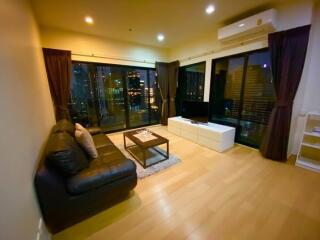 Modern living room with city view at night