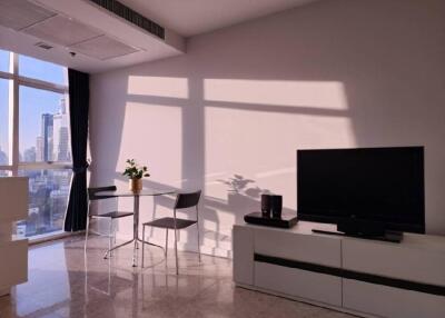 Modern living space with TV and dining table