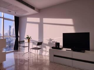 Modern living space with TV and dining table