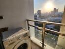 Balcony with washing machine and city view